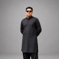 Elegant Portrait in Black Traditional Attire with Modern Home Background